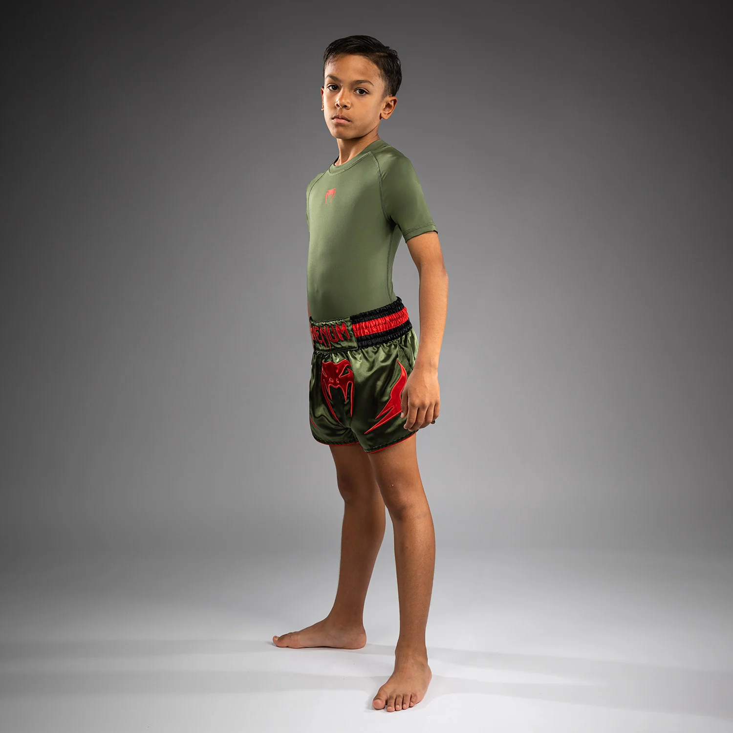 Venum Inferno Kinder Muay Thai Shorts - Armeegrün/Orange - Image 6